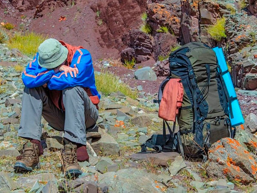 "Traveler enjoying the scenic Andes in Cusco, prepared for high-altitude travel."